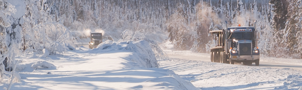 Winterize Your Fleet - Trucks Driving in Snowy Weather