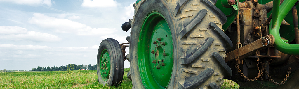 Tractor in Field Using Industrial Greases for Car Machinery & Equipment
